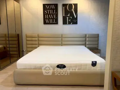 Luxurious bedroom with modern decor and plush mattress, perfect for relaxation and comfort.