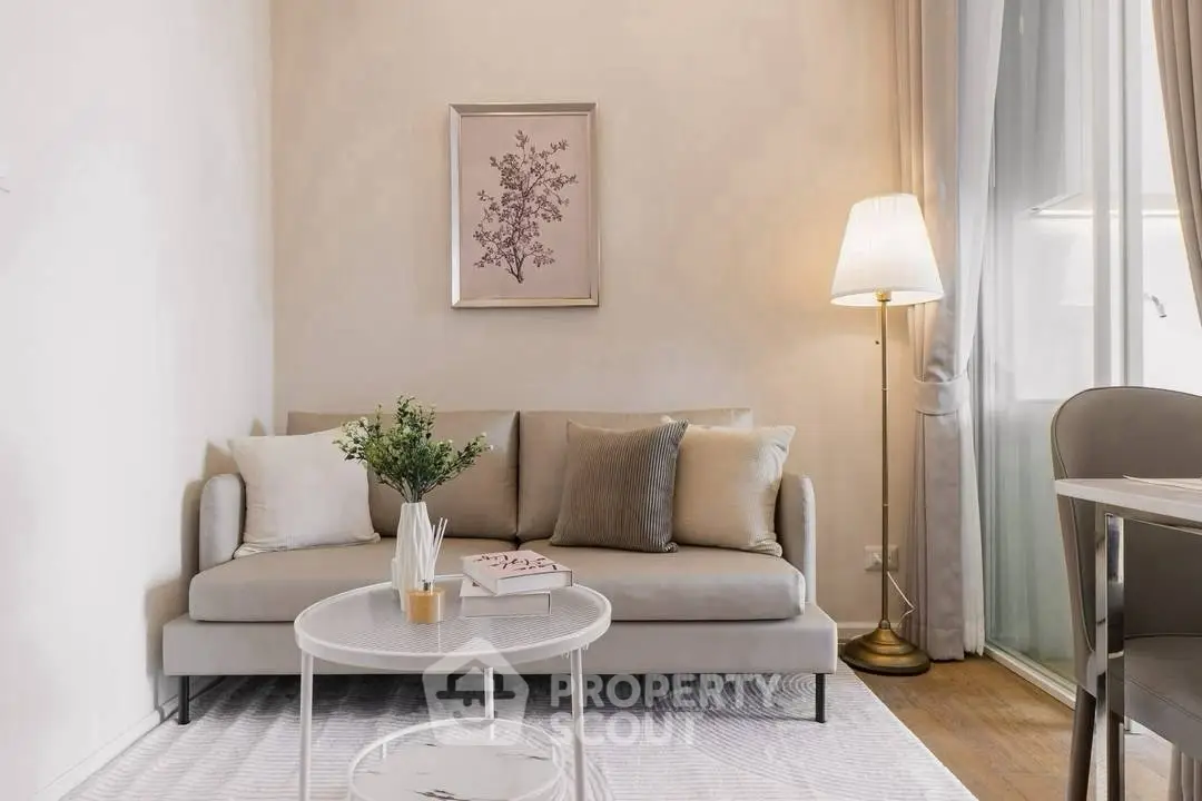 Chic living room with elegant decor, cozy sofa, stylish lamp, and modern coffee table in a bright apartment.