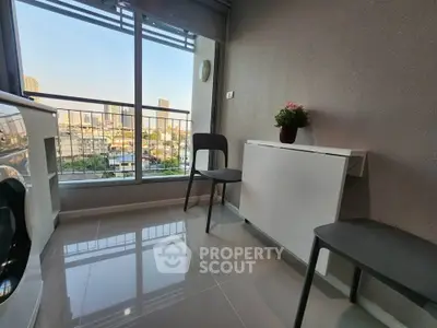 Modern balcony with sleek chairs and city view, perfect for relaxation and enjoying the skyline.