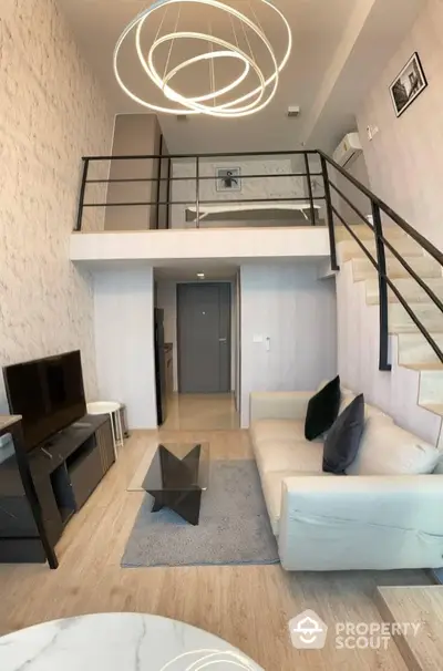 Modern loft apartment with stylish living room and mezzanine bedroom