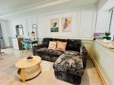 Stylish living room with plush sofa, chic decor, and cozy ambiance