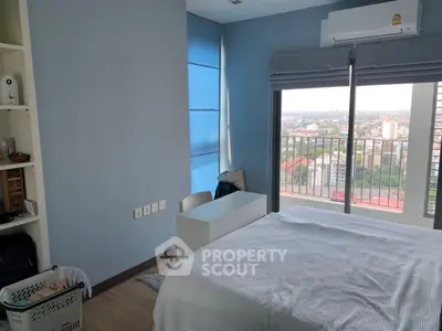 Modern bedroom with city view and balcony access