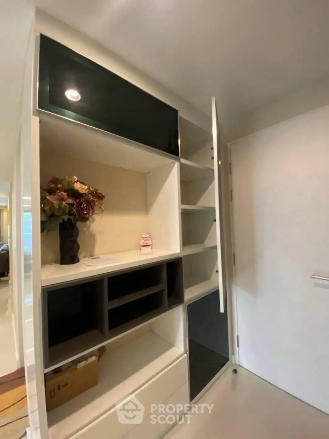 Modern storage unit with sleek design and ample shelving in a contemporary home interior.