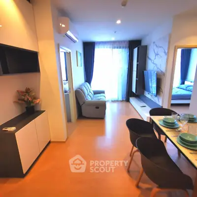 Modern open-plan living room with dining area and stylish decor
