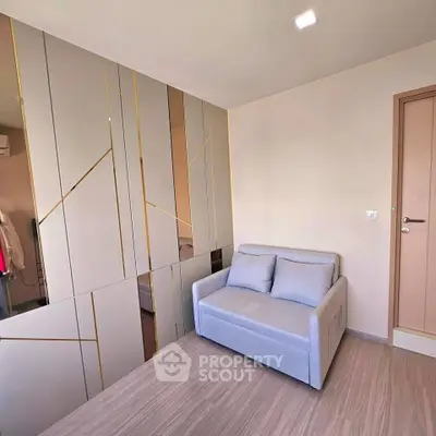 Modern minimalist living room with stylish sofa and sleek wall design