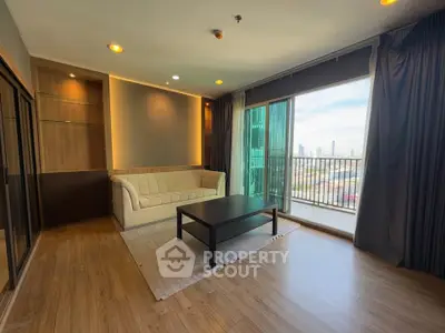 Spacious living room with city view and elegant wooden flooring