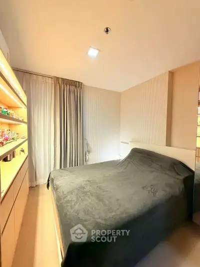 Cozy bedroom with modern decor and ample natural light