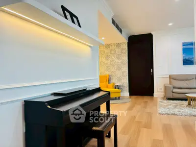 Stylish living room with piano, modern decor, and cozy seating area.