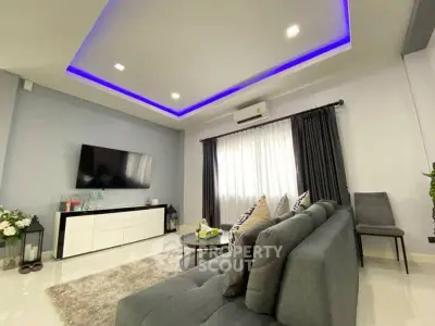 Modern living room with stylish decor and ambient lighting