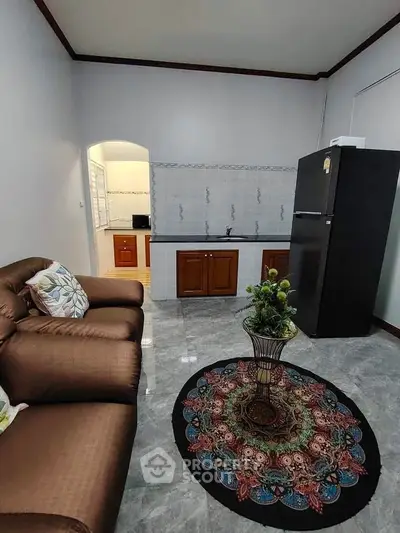 Cozy living room with modern kitchen and stylish decor