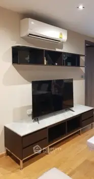 Modern living room with sleek TV unit and air conditioning