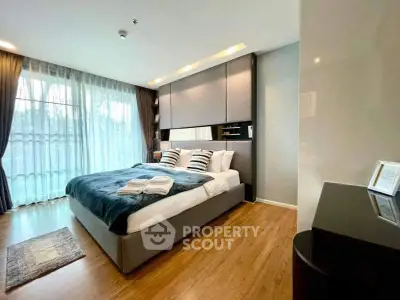 Luxurious modern bedroom with large windows and elegant decor