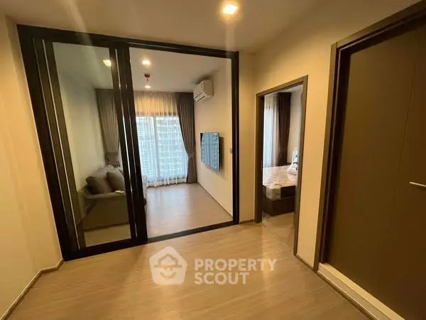 Modern apartment interior with glass partition and cozy living area
