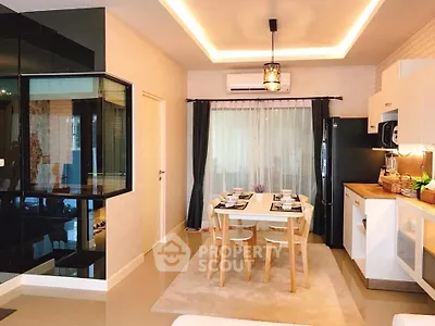 Modern dining area with stylish kitchen and elegant lighting