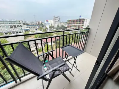 Charming balcony with city view, perfect for relaxation and enjoying the skyline.