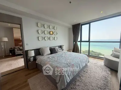 Luxurious bedroom with stunning ocean view and elegant decor
