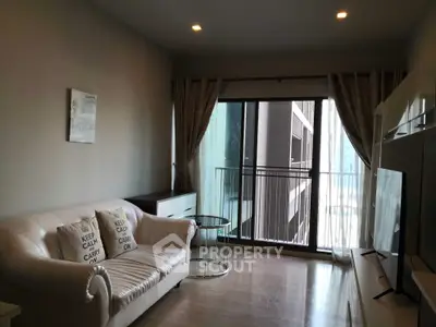 Stylish living room with elegant sofa and balcony view in modern apartment