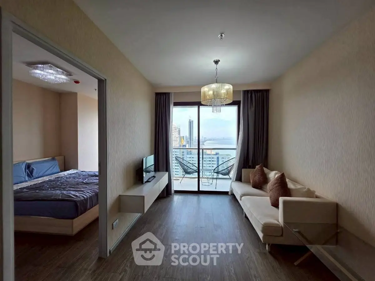 Modern apartment with spacious living room and balcony offering stunning city views