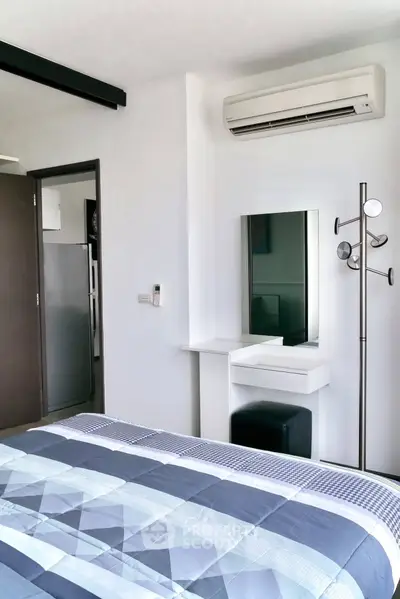 Modern bedroom with air conditioning and stylish decor in a contemporary apartment.