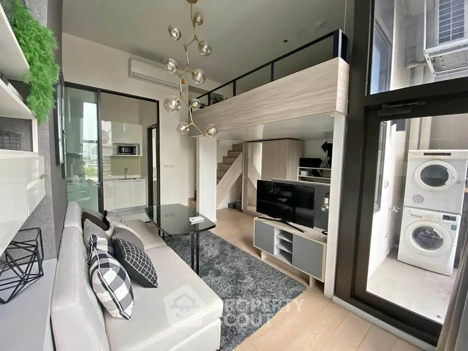 Modern loft apartment with stylish living room and mezzanine, featuring sleek furniture and natural light.