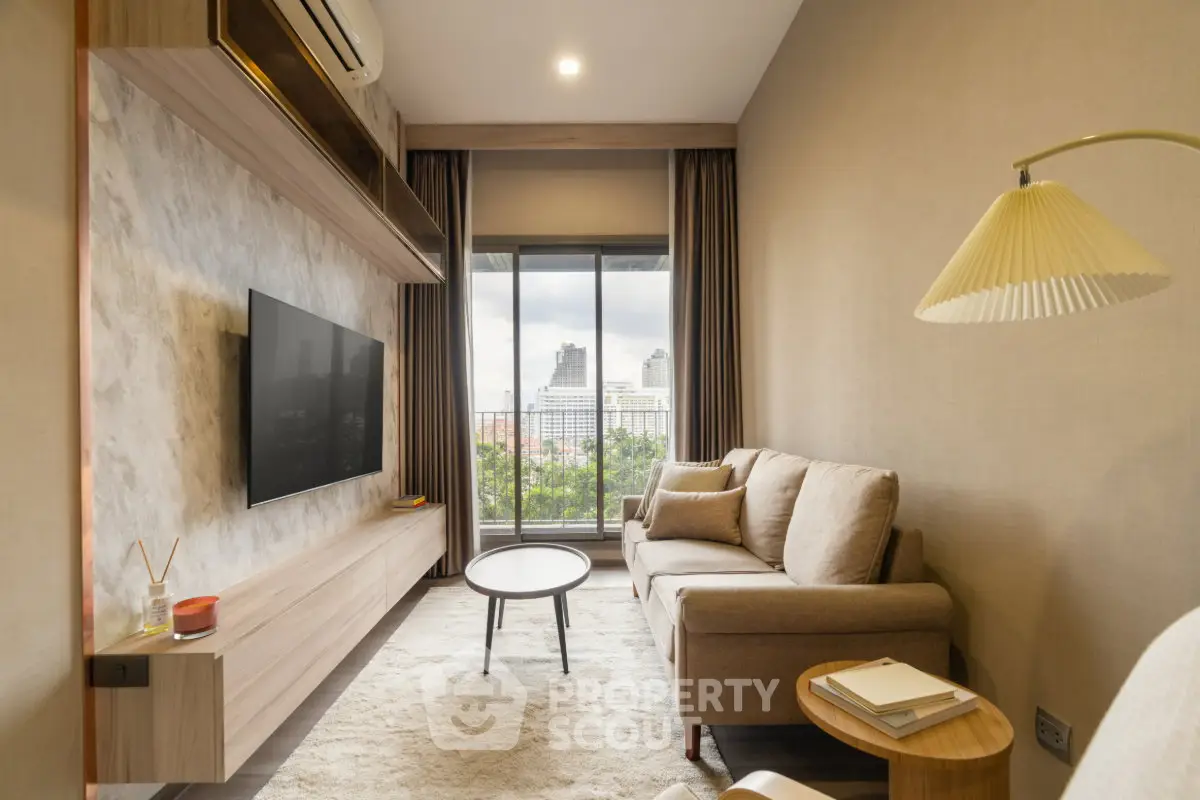 Modern living room with city view, featuring cozy sofa and stylish decor.