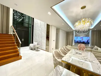 Luxurious modern living room with elegant chandelier and marble dining table