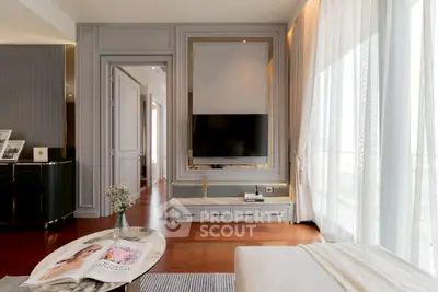 Luxurious living room with modern decor and large windows for natural light.