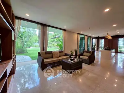 Luxurious living room with garden view and elegant furnishings