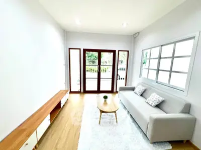 Bright and airy living room with modern furniture and large windows