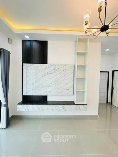 Modern living room with elegant marble feature wall and stylish lighting