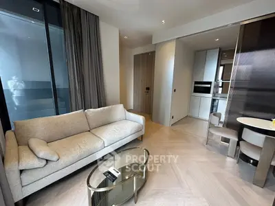 Modern living room with elegant sofa and open kitchen layout in luxury apartment