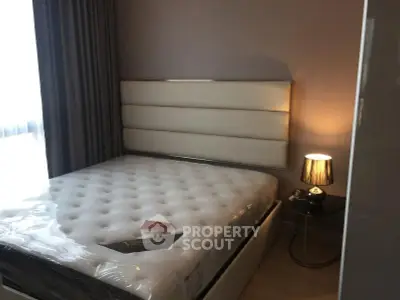 Modern bedroom with stylish headboard and cozy lighting