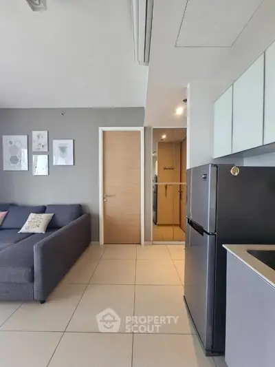 Modern apartment interior with sleek kitchen and cozy living area