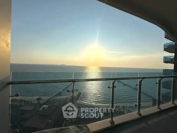 Stunning ocean view from a modern balcony at sunset, perfect for relaxation and enjoying the serene seascape.