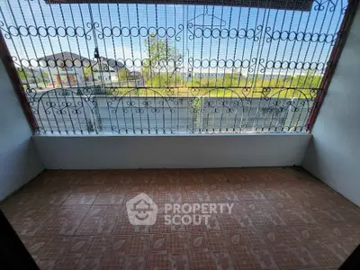 Charming balcony with intricate ironwork and scenic view, perfect for relaxation and enjoying the outdoors.