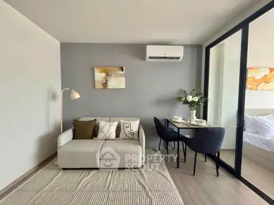 Modern living room with cozy sofa and dining area in stylish apartment