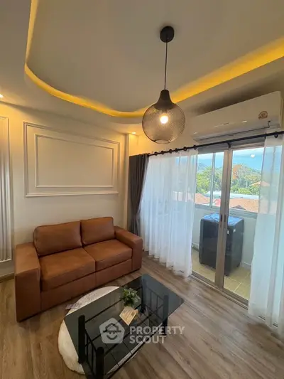 Modern living room with stylish lighting and balcony view