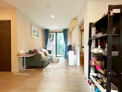 Spacious living room with modern decor and balcony access in a stylish apartment.