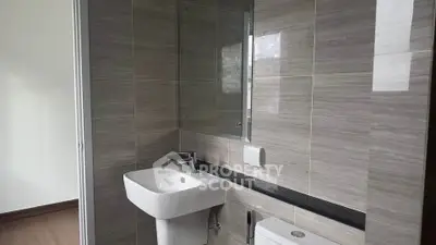 Modern bathroom with sleek fixtures and elegant tile design