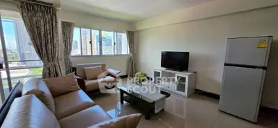 Spacious living room with modern furniture and city view, perfect for urban living.