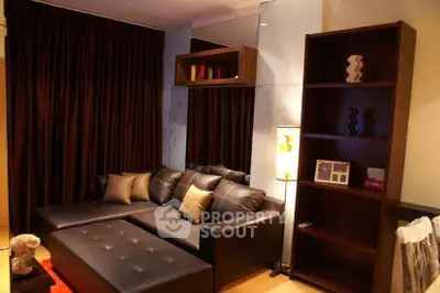 Cozy living room with dark leather sofa and elegant decor
