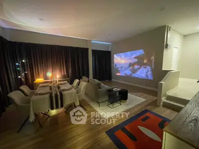 Stylish living room with dining area and home theater setup