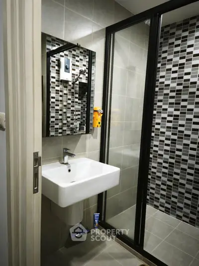 Modern bathroom with sleek design and glass shower enclosure