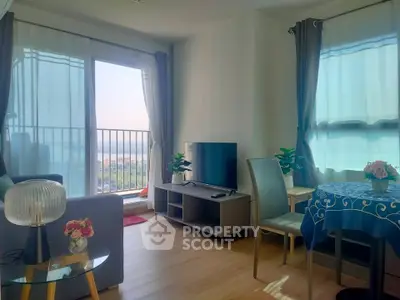 Bright and airy living room with modern decor and scenic view from balcony.