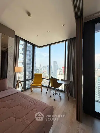 Luxurious bedroom with panoramic city views and stylish modern furniture.