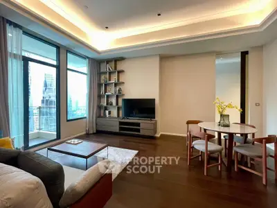 Spacious modern living room with large windows and city view, featuring elegant furniture and stylish decor.