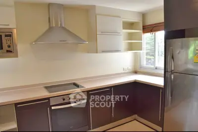 Modern kitchen with sleek cabinets and stainless steel appliances