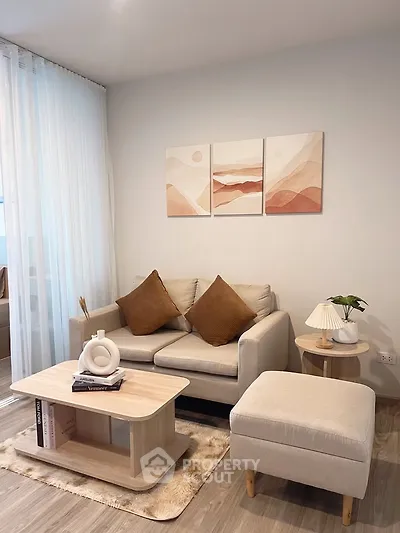 Stylish modern living room with cozy sofa, chic decor, and elegant lighting, perfect for relaxation and entertaining.