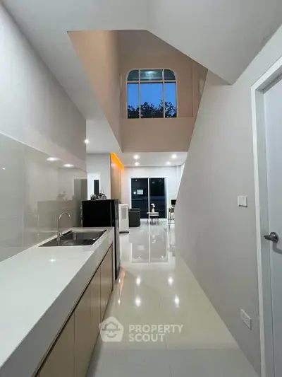 Modern kitchen with sleek design and open layout in contemporary home