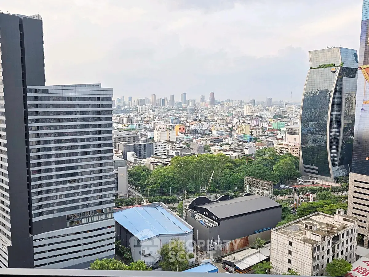 Stunning cityscape view from high-rise building showcasing urban skyline and modern architecture.